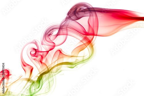 color smoke flowing over white background . abstract .
