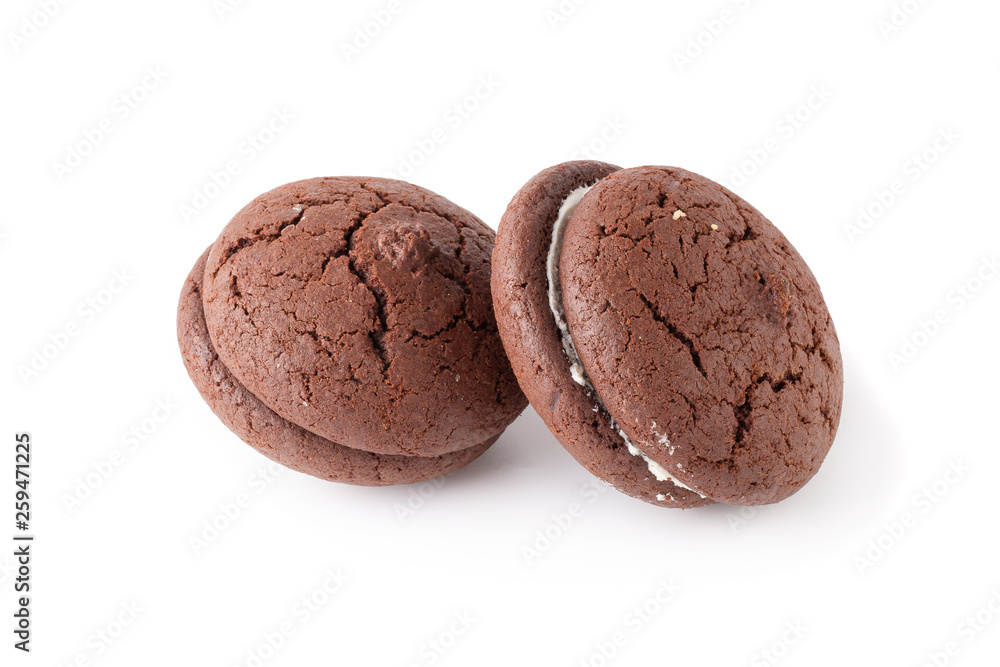 Sandwich chocolate cookies and cream on a white plate isolated over white background