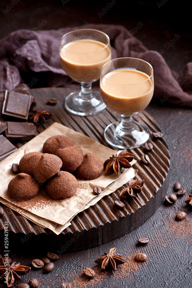  Sweet chocolate candy with liqueur in glass, dessert table