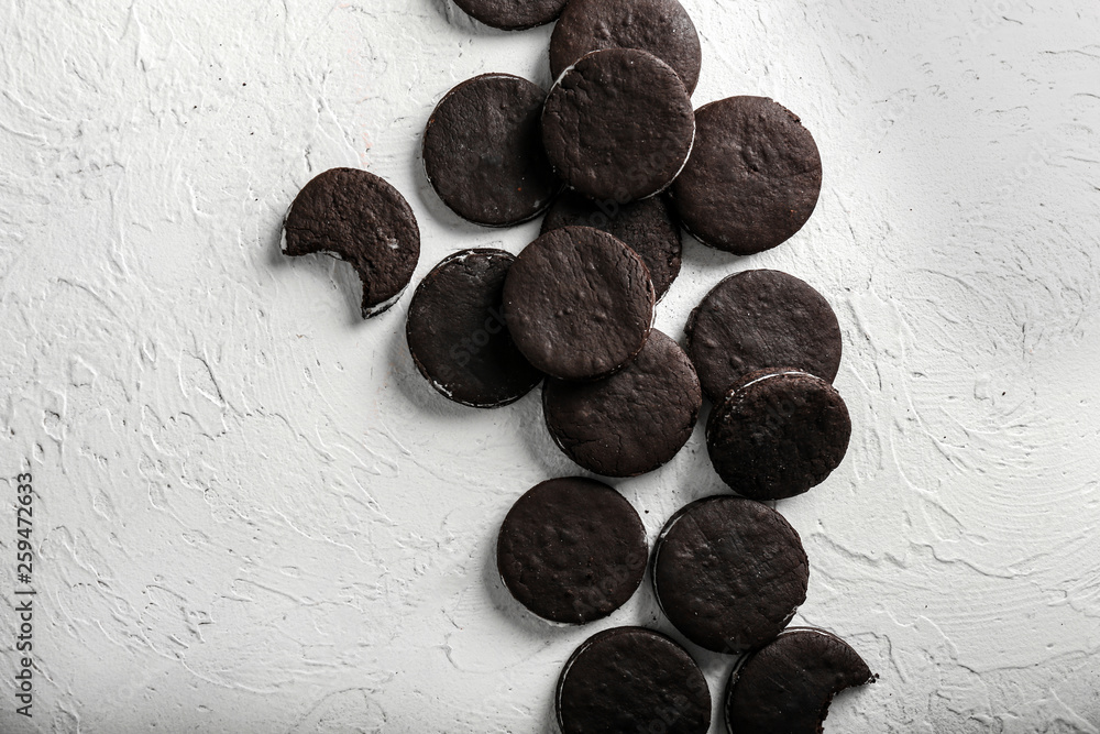Fototapeta premium Tasty chocolate cookies on white textured background