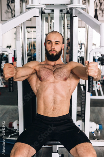 Muscular guy in the gym