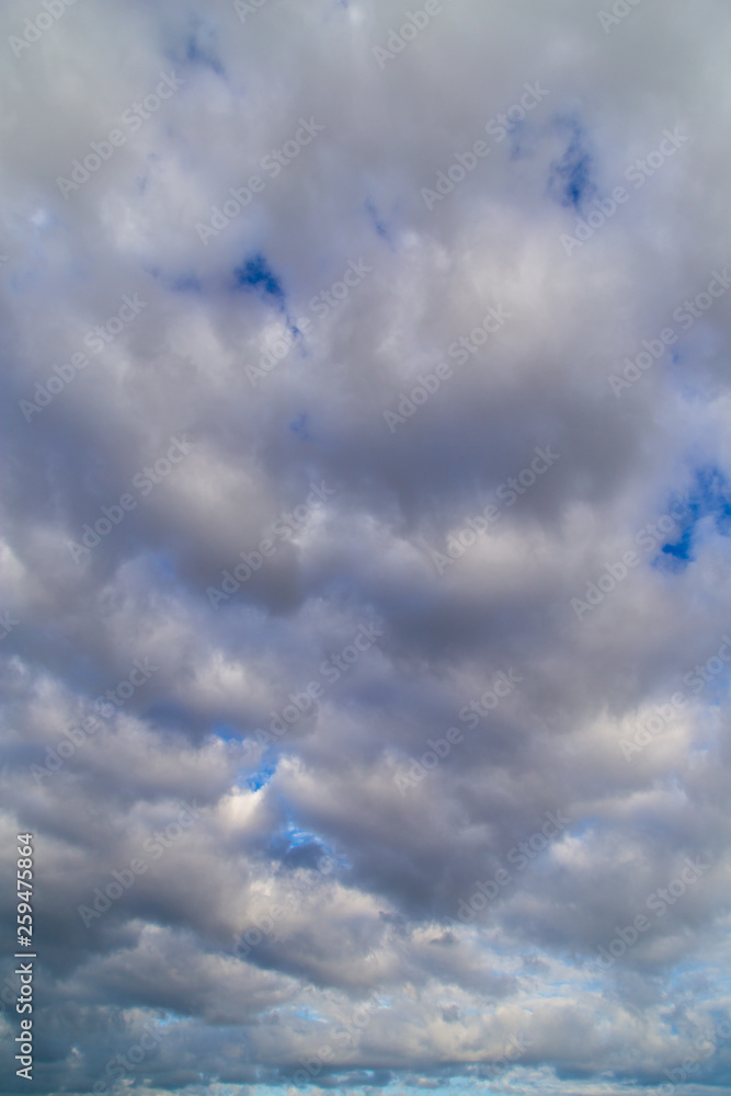 Clouds against the blue sky as a background Clouds against the blue sky as a background