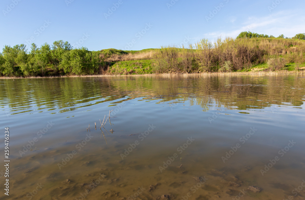 Pond in spring steppe as background