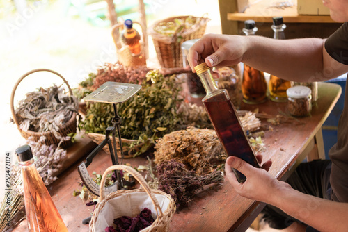 potion bottle in hand of herbalist