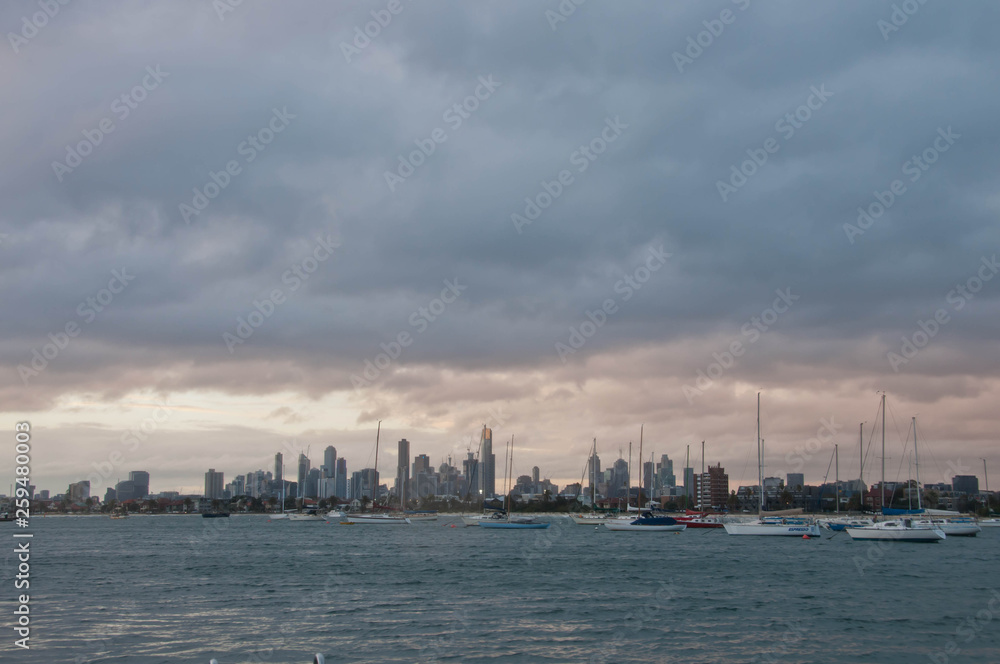 Wide angle evening scene of skyscrapers horizon with ocean and tall office and residential towers in Melbourne Australia Wide angle evening scene of skyscrapers horizon with ocean and tall office and residential towers in Melbourne Australia