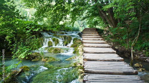 Cascade waterfalls and wooden pathway over the water  Plitvice Lakes in Croatia  National Park