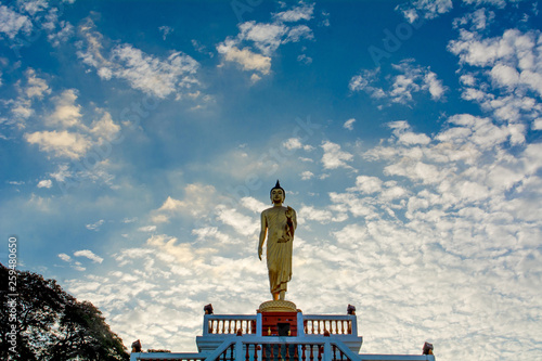 Standing Buddha image And the blue sky, religious concepts