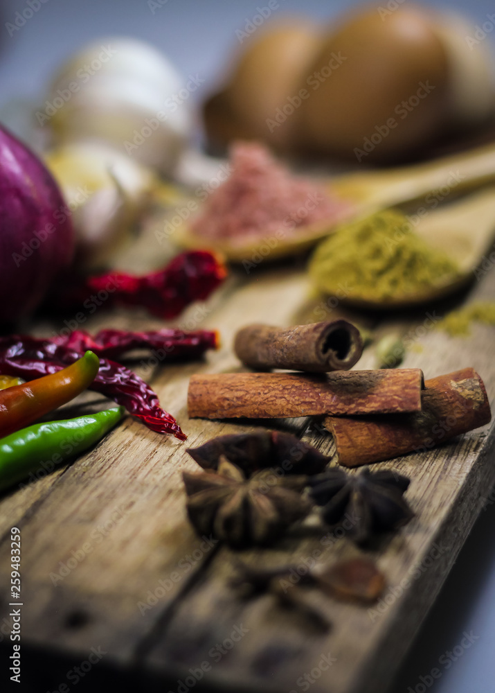 Close up of variety of asian spices and common ingredients on wooden deck. Close up of variety of asian spices and common ingredients on wooden deck.