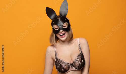 Sexy blonde girl with leather bunny ears 