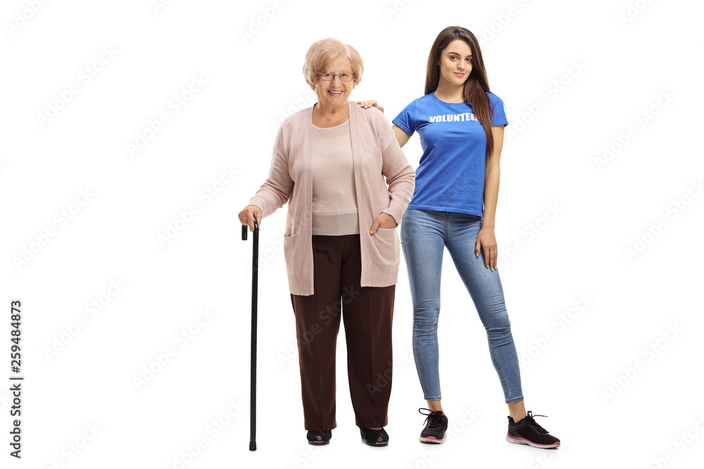 Elderly woman with a cane and a young female volunteer isolated Elderly woman with a cane and a young female volunteer isolated