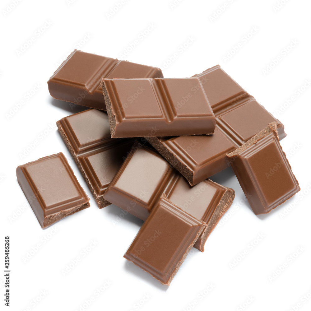 Milk organic chocolate pieces isolated on white background Milk organic chocolate pieces isolated on white background