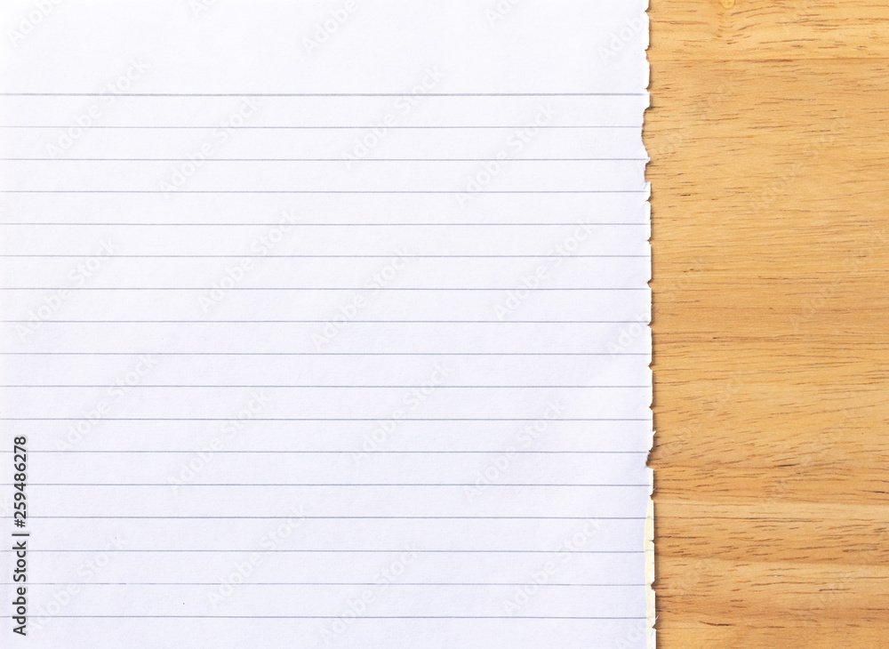 Obraz premium Notebook Lined Paper on wood Background