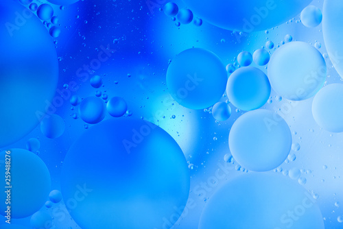 Wallpaper Mural water drops on glass with blue background, close-up  Torontodigital.ca