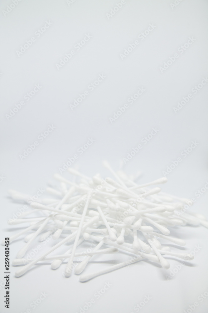 Vertical banner with cotton buds heap isolated on the white copy space background Vertical banner with cotton buds heap isolated on the white copy space background