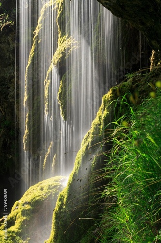 Schleierfalle, waterfalls at Ammer covered in moss, sunlight, Ammergau Alps, Bavaria, Germany, Europe photo