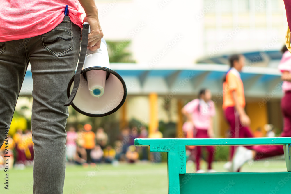 Fototapeta BANGKOK, THAILAND - January 15,2019 At the school's annual sporting event, Elementary student girls with their coach in the chair ball sports match
