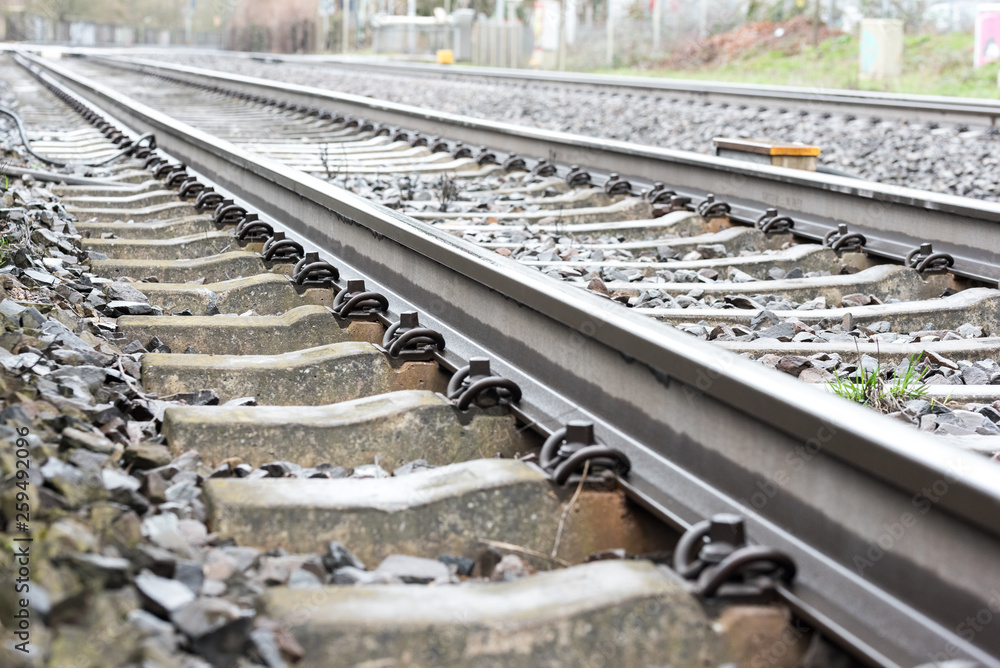railway tracks in a track bed with stones in detail railway tracks in a track bed with stones in detail