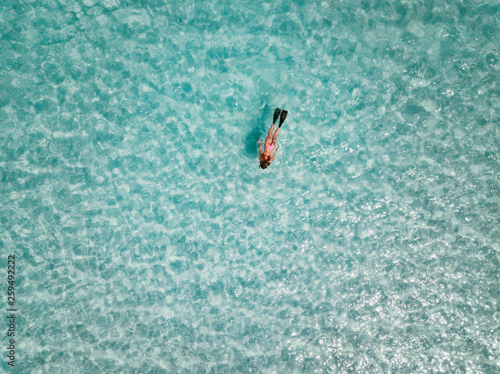 Female snorkeler in turquoise waters. exuma bahamas
