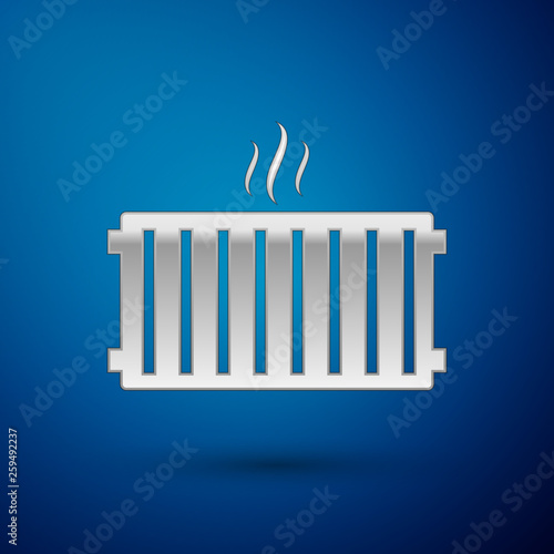 Silver Heating radiator icon isolated on blue background. Vector Illustration