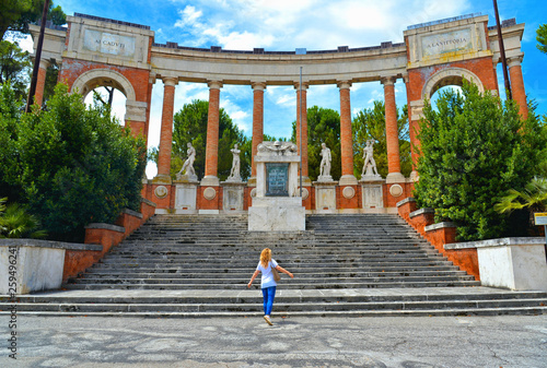 old historical monument to the fallen and to victory with steps, statues and columns in center of Macerata, Marche Italy