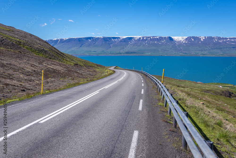 Asphalt road on the Vikurskard mountain pass near Akureyri city in the north part of Iceland Asphalt road on the Vikurskard mountain pass near Akureyri city in the north part of Iceland