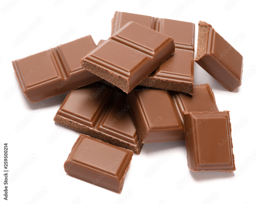 Milk organic chocolate pieces isolated on white background Milk organic chocolate pieces isolated on white background