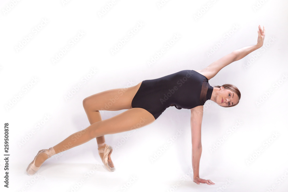Young beautiful ballet dancer is posing in studio Young beautiful ballet dancer is posing in studio