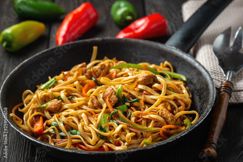 Chow mein with chicken, Chinese dish. photo
