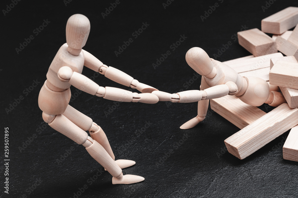 Personal and professional help. Depression and breakdown aid. Conceptual articulated mannequin rescue composition. Personal and professional help. Depression and breakdown aid. Conceptual articulated mannequin rescue composition.