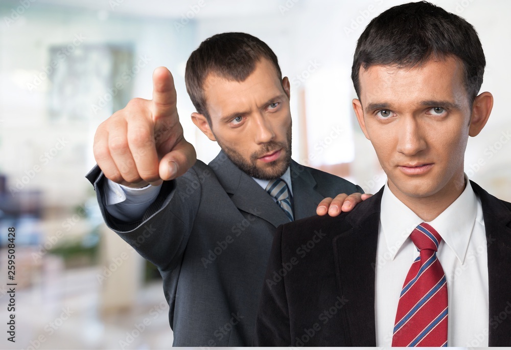 Two businessmen arguing on background Two businessmen arguing on background