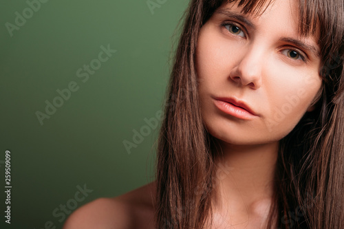 Confused looking beautiful girl. Disappointed facial expression. Closeup portrait of emotional lady. Copy space.