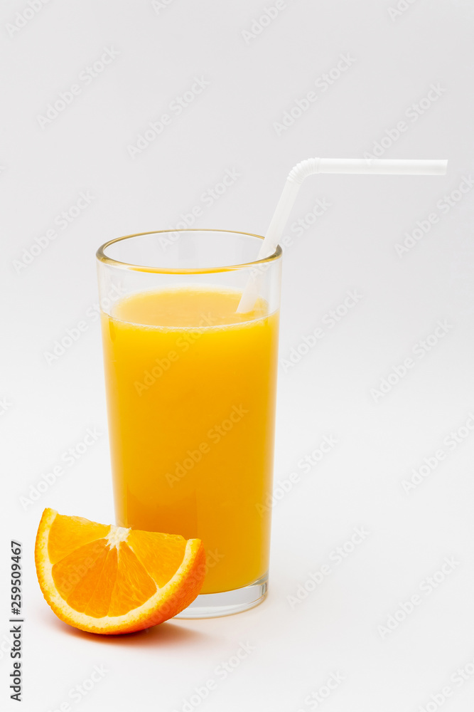 a glass of orange juice and a slice of orange on a white background a glass of orange juice and a slice of orange on a white background