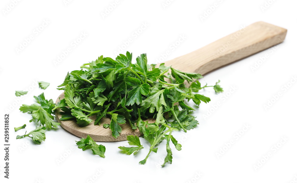 Fresh green parsley leaves with wooden spoon isolated on white background Fresh green parsley leaves with wooden spoon isolated on white background