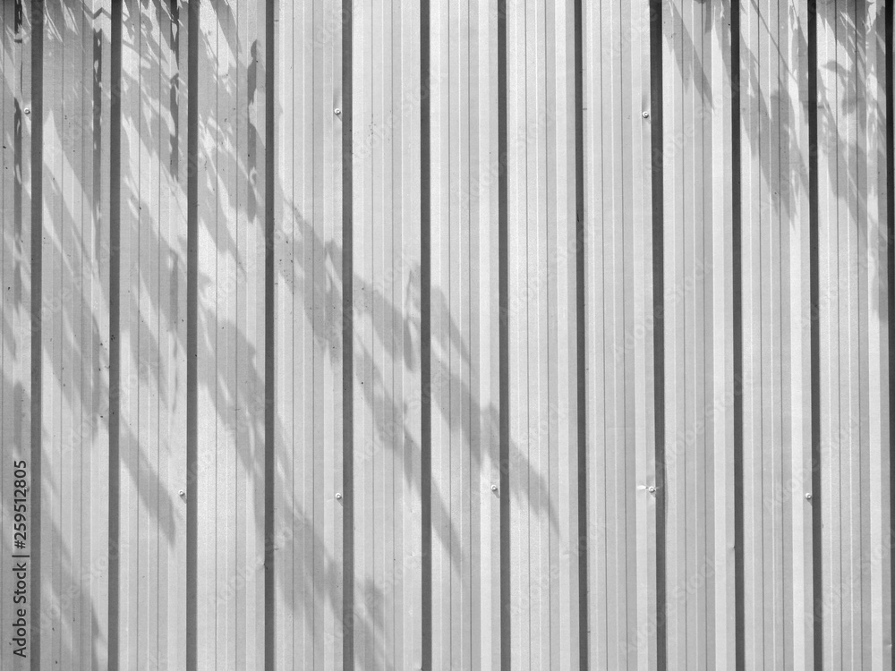Corrugated metal sheet with tree shadow Corrugated metal sheet with tree shadow