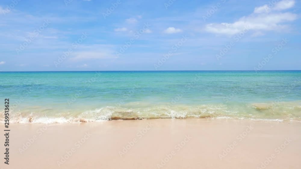 Empty beach with calm waves and some clouds in the sky. Empty beach with calm waves and some clouds in the sky.