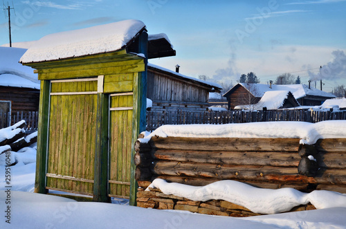 Mountain village Tirlyan (southern Urals). The restoration of the old house begins with a large entrance gate.
