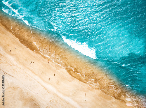 Aerial photo of summer beach and blue ocean with sky. 
