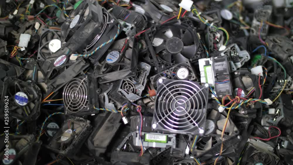Close up of computer components being thrown on the stack for recycling Close up of computer components being thrown on the stack for recycling