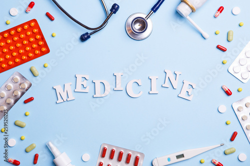 Cold medicine, thermometer, phonendoscope and word medicine