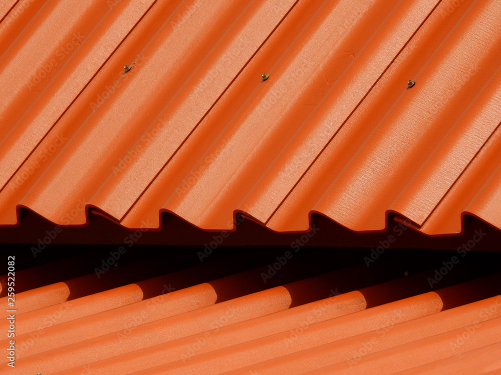 orange metal tile roof closeup orange metal tile roof closeup