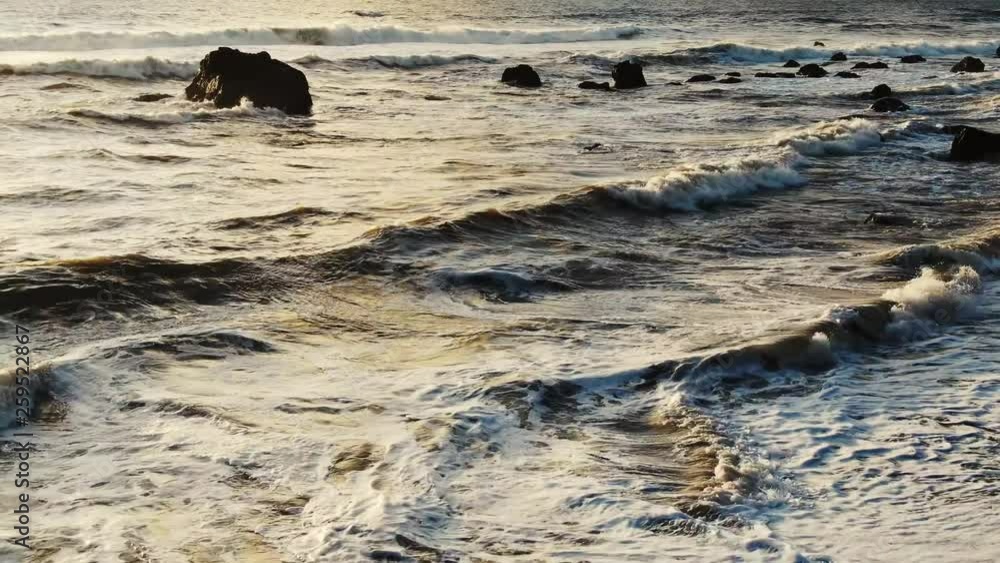 Journey to the sun setting on a Northern California Beach, Sun Rays highlight the surf breaking on weathered stone. Journey to the sun setting on a Northern California Beach, Sun Rays highlight the surf breaking on weathered stone.