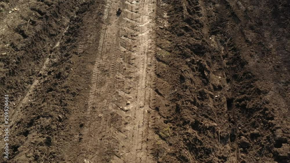 Dirt road mud after raining day 4K drone video Dirt road mud after raining day 4K drone video