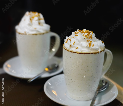 Two glasses of coffee with whipped cream
