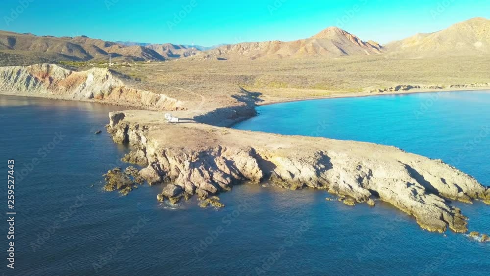 Aerial view of two RVs camping on a cliff overlooking the Sea of Cortez in Baja California near Mulege, Mexico. Travelling adventure and off the grid concept.