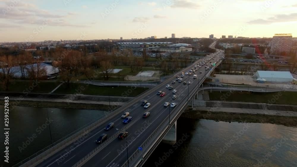 Busy traffic on Lazienkowski Bridge in Warsaw capital Poland at evening, drone shot