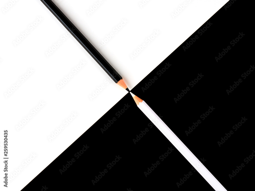 Black and white pencils on a contrasting background