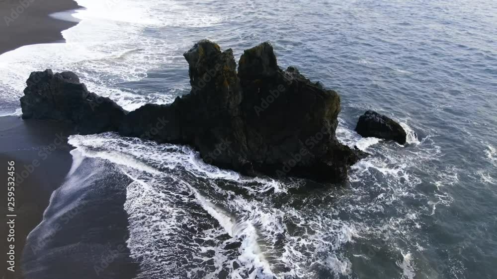 Flying the beach at Sunset in Northern California circling stonehenge esque monolith jutting up from surf Flying the beach at Sunset in Northern California circling stonehenge esque monolith jutting up from surf