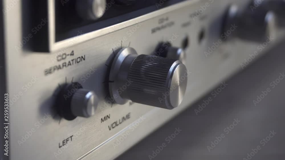 Turning volume up/down on old amplifier. Turning volume up/down on old amplifier.