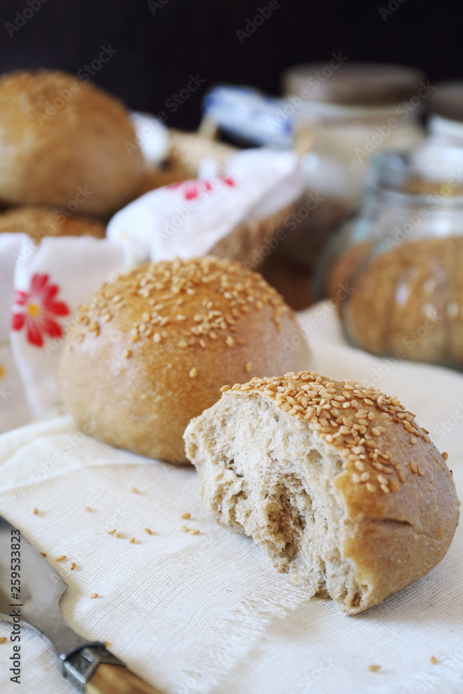Fresh homemade sourdough bread buns with sesame