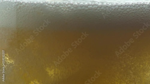 Wallpaper Mural Close up of a golden hops fizzy drink being poured into a glass with ice. Torontodigital.ca